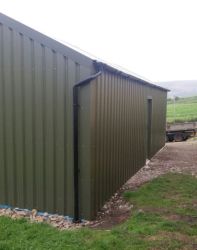 Steel cladding in place on agricultural storage building
